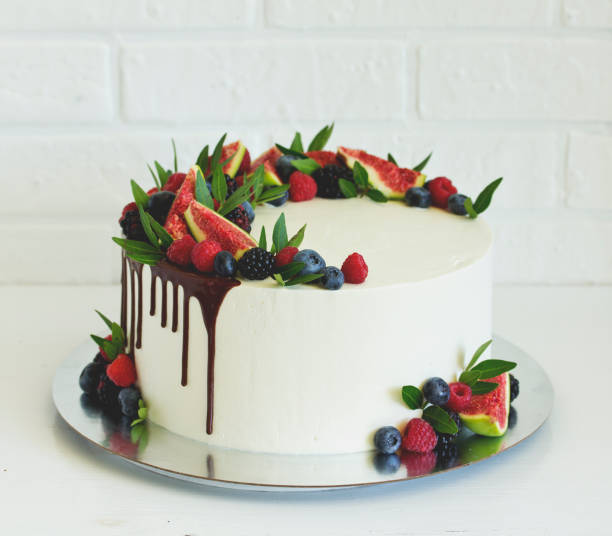 istock Sponge cake for his birthday on a black background. 1279381772