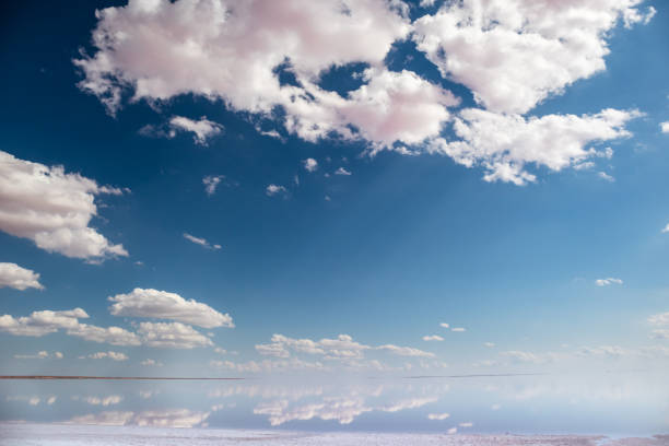 istock Salt lake water mirror with pink clouds, blue sky 1279382971