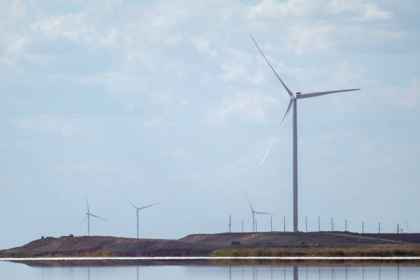 istock Wind generators energy farm on sea coast 1279383006