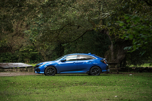 Ucieda, Spain. 07 September 2020: A modern blue Honda Civic car parked in a natural area