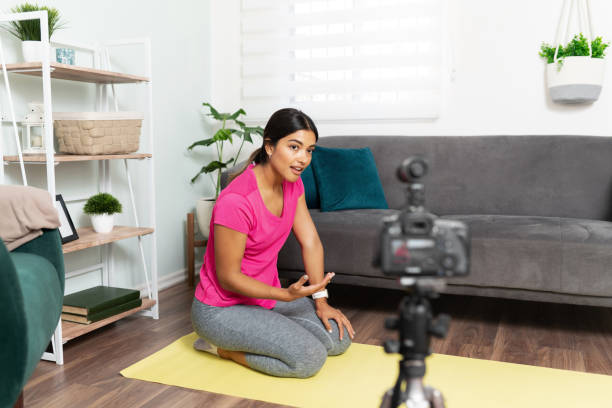 istock Hispanic fitness coach talking on camera 1279384143