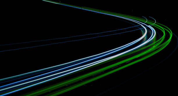 istock green car lights at night. long exposure 1279385152