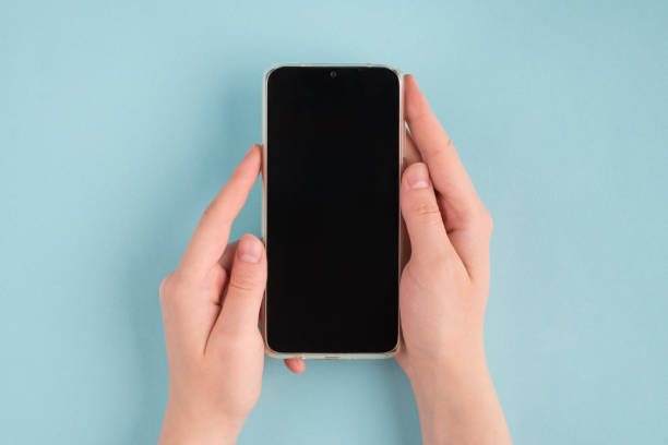 istock Live chat help service delivery application concept. Top above overhead close up first person view photo of female hands holding smartphone big screen copy space isolated color pastel background 1279385383