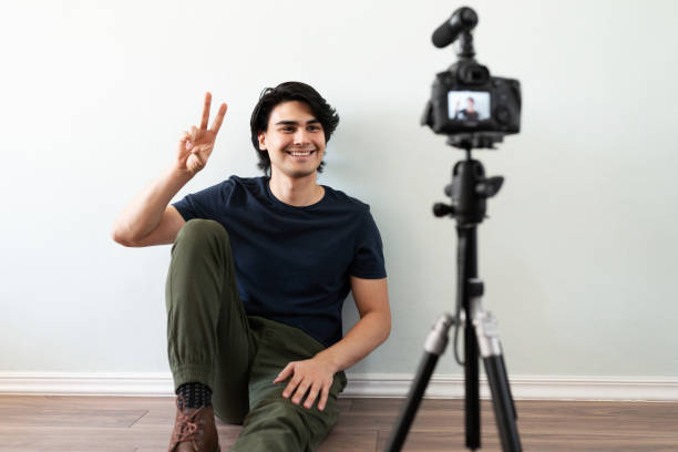 istock Saying hello to his online followers 1279385414