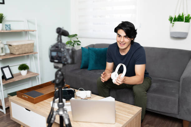 istock Blogger reviewing some technology 1279385616