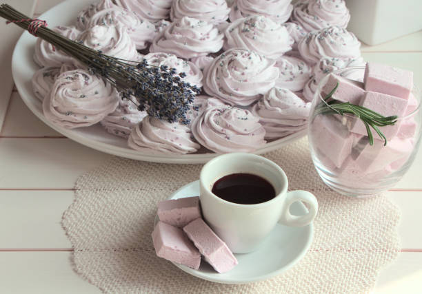 istock Cup of coffee and marshmallows on the table. 1279387640