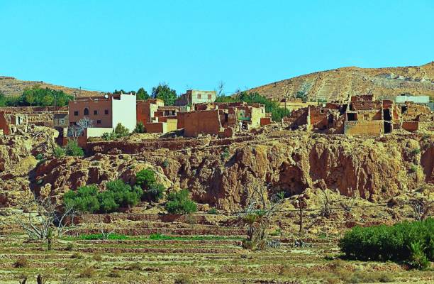 istock Stone houses over a sandstone rock. 1279387678