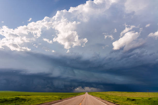 istock Straight road and storm clouds 1279387685