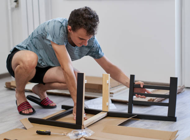 istock Young man assembling his furniture 1279392031