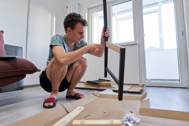 istock Young man assembling his furniture 1279393913