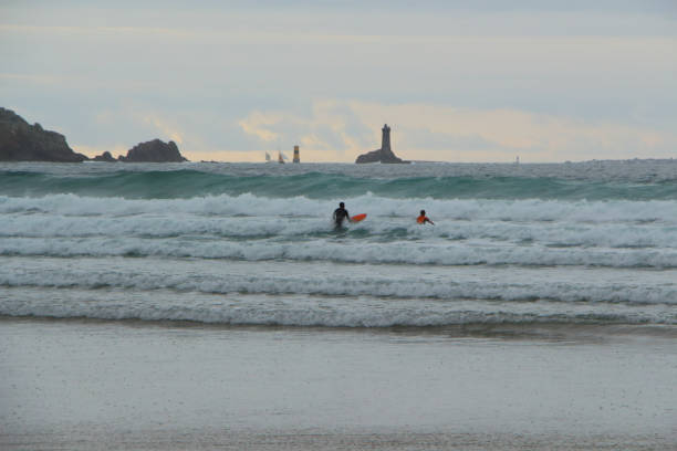 istock Surfers at Trepasses Bay in Plogoff 1279395071