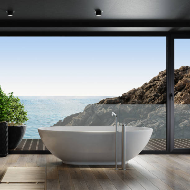 istock Luxurious apartment bathroom interior with large panoramic window and back wall slate stone. 1279400126