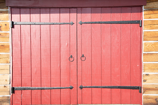 old abstract red colorful painted exfoliate peeled off rustic wooden boards, wooden gate, wooden door texture - wood wall background banner panorama long shabby