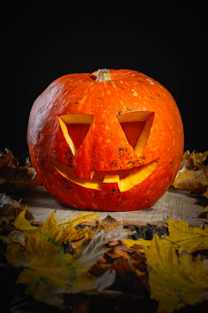 istock Halloween Pumpkin On Wood In A Spooky Forest At Night 1279402758