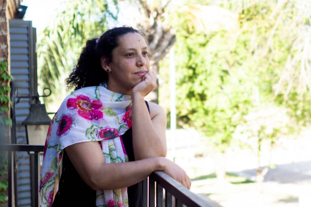 istock Latina woman on the balcony 1279405284