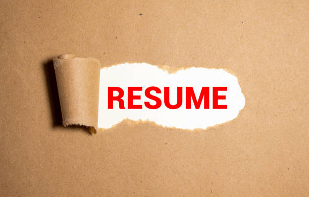 istock Blank white space in torn brown paper with word RESUME black paper. 1279410940