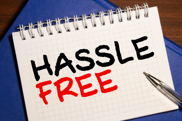 istock The words Hassle Free in red text on a note card pinned to a cork notice board 1279410943