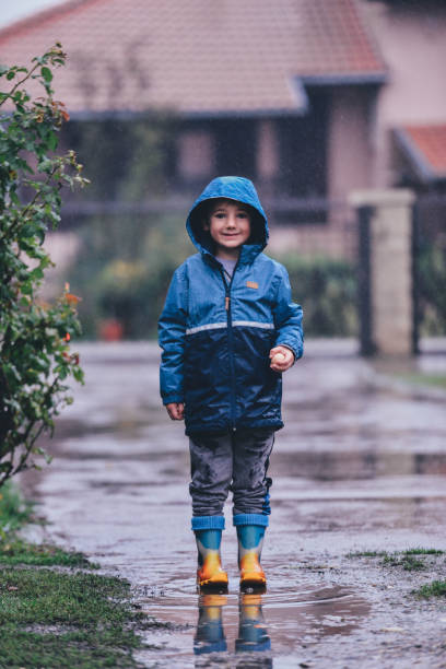 istock A young boy outside in the rain 1279412381