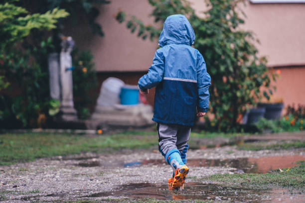 istock A young boy outside in the rain 1279412383