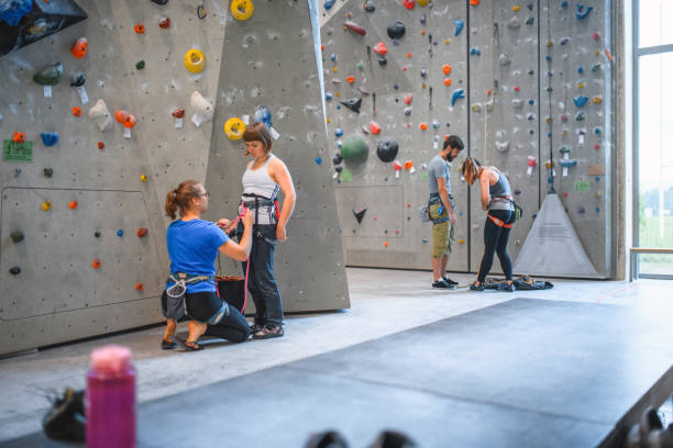 istock Sport Climbing Teammates Helping Each Other With Harnesses 1279415798
