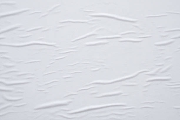 istock Blank white crumpled and creased paper poster texture background 1279416042