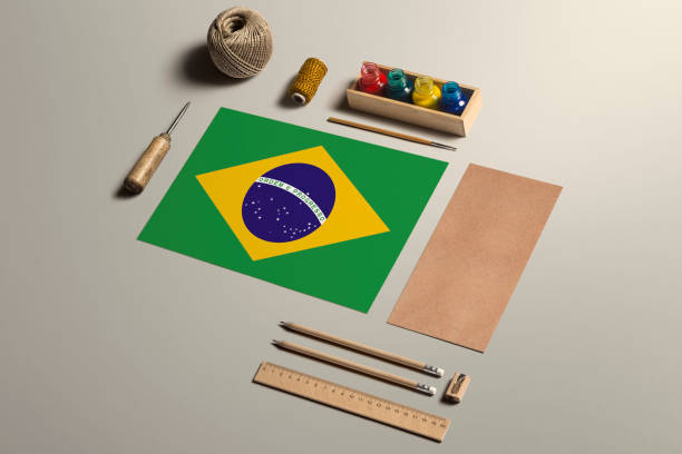 istock Brazil calligraphy concept, accessories and tools for beautiful handwriting, pencils, pens, ink, brush, craft paper and cardboard crafting on wooden table. 1279416061