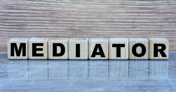 istock MEDIATOR - word on wooden cubes on a gray background 1279417839