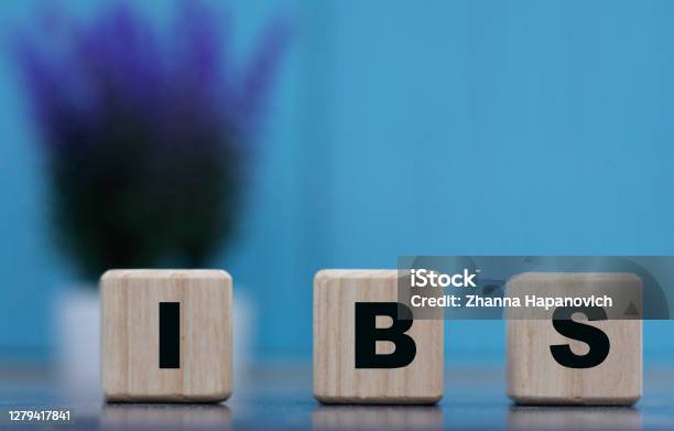 Ibs Word On Cubes On A Blue Background With Lavender Stock Photo - Download Image Now