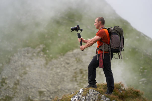 istock Filmmaker shooting with camera on gimbal 1279418734