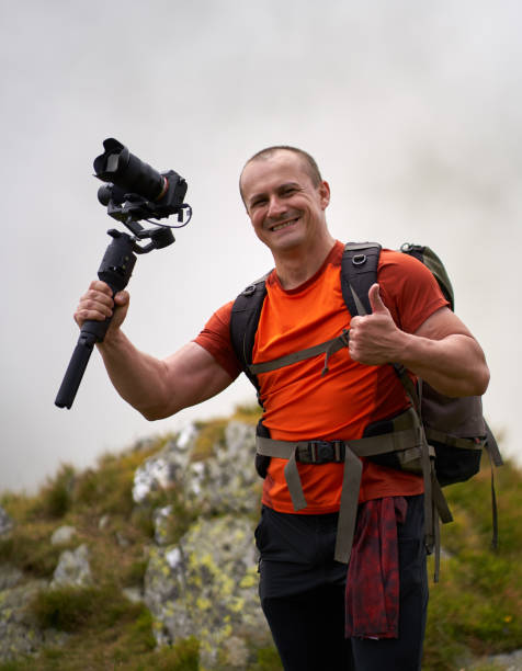 istock Filmmaker shooting with camera on gimbal 1279418741