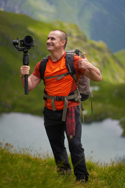 istock Filmmaker shooting with camera on gimbal 1279418742