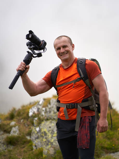 istock Filmmaker shooting with camera on gimbal 1279418743