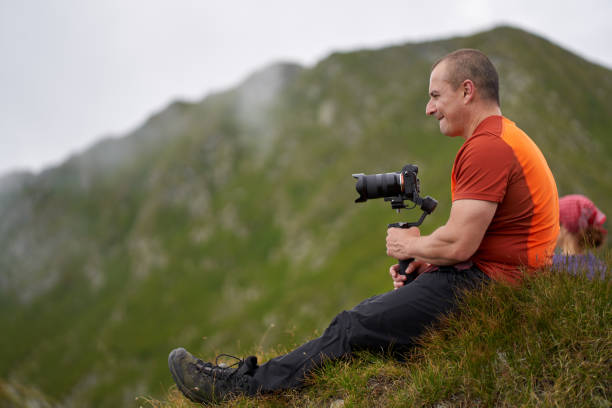 istock Filmmaker shooting with camera on gimbal 1279418755