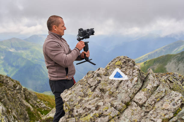 istock Filmmaker shooting with camera on gimbal 1279418764