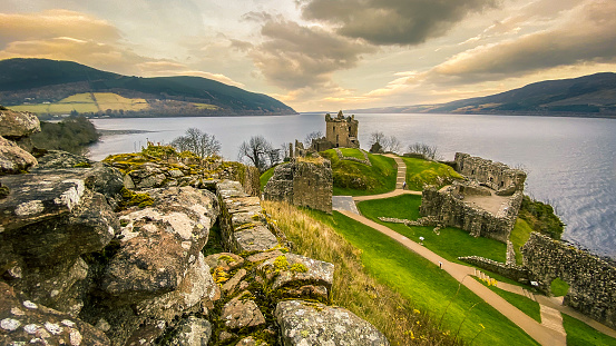 Urquhart Castle ruins on the banks of Loch Ness, Scotland. View out towards The Grant Tower with the Loch stretching into the distance.