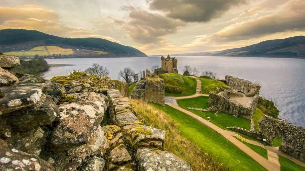 Urquhart Castle, Scotland Urquhart Castle ruins on the banks of Loch Ness, Scotland. View out towards The Grant Tower with the Loch stretching into the distance. scottish highlands photos stock pictures, royalty-free photos & images