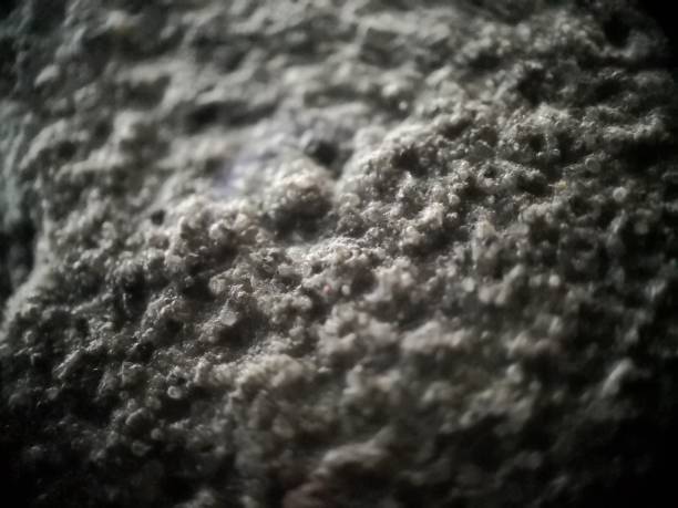 istock close up 50x super macro photo of concrete floor, microscope texture. 1279420517