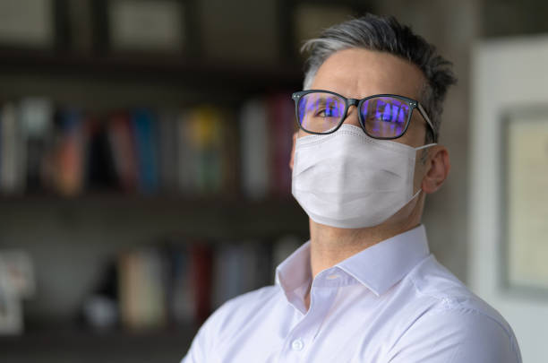 istock Thoughtful business man wearing a facemask at the office 1279421222
