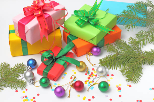 istock A stack of multi-colored envelopes with congratulations on Christmas or the New Year, fir branches and Christmas balls, close-up. white  background. 1279422256