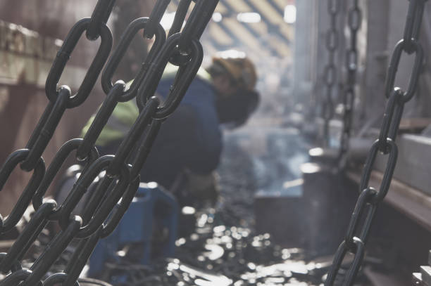 welder doing welding on deck of ship lashing cargo - naval ship imagens e fotografias de stock