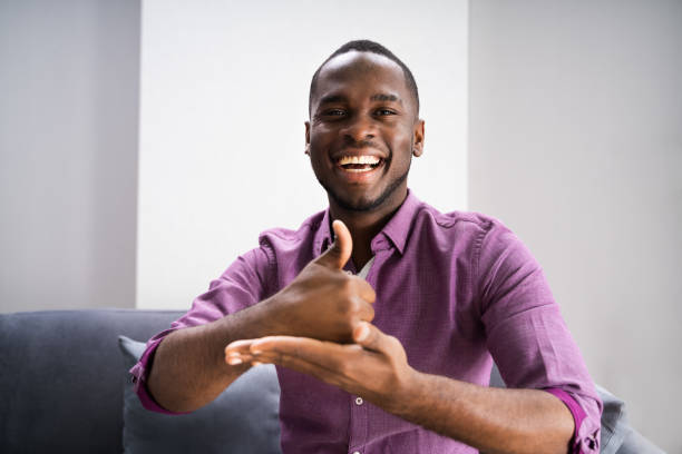 African American Deaf Man African American Deaf Man Using Sign Language deafness photos stock pictures, royalty-free photos & images