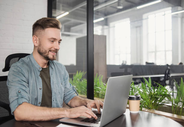 istock Businessman creative professional working on laptop computer in office 1279447218