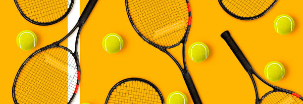 istock Tennis racket balls on yellow background 1279448097