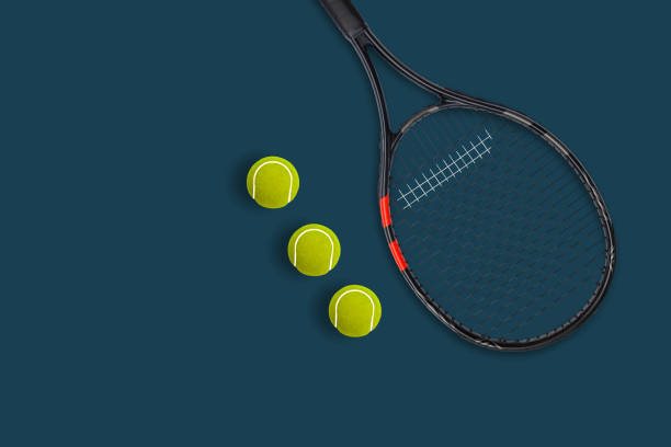 istock Tennis racket balls on blue background 1279448149