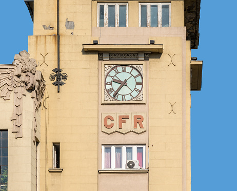 Bucharest/Romania - 09.27.2020: Old vintage clock on the building of the Romanian Railway Society (CFR).