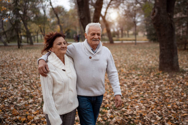 istock Cheerful senior couple enjoying autumn walk 1279448476