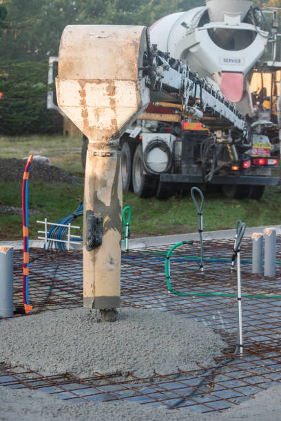 istock mixer truck pouring concrete on the construction site 1279450408