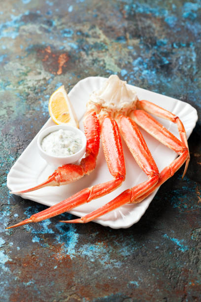 istock Crab leg with tartar sauce and lemon 1279453239