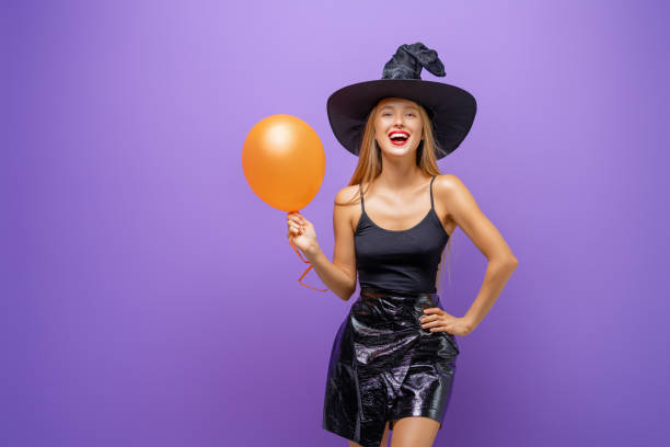 istock Two young women in black witch costumes 1279455415