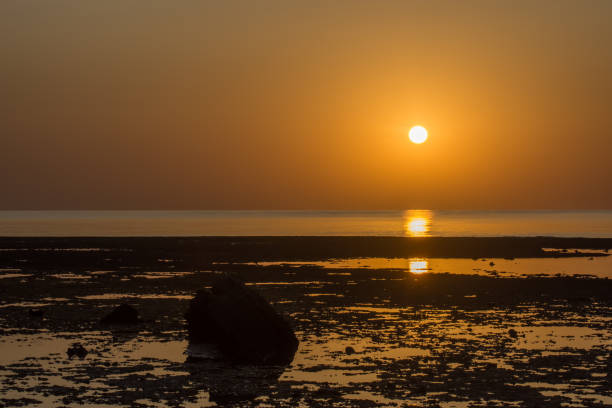 istock sunrise with reflection at the corals and stones 1279457149